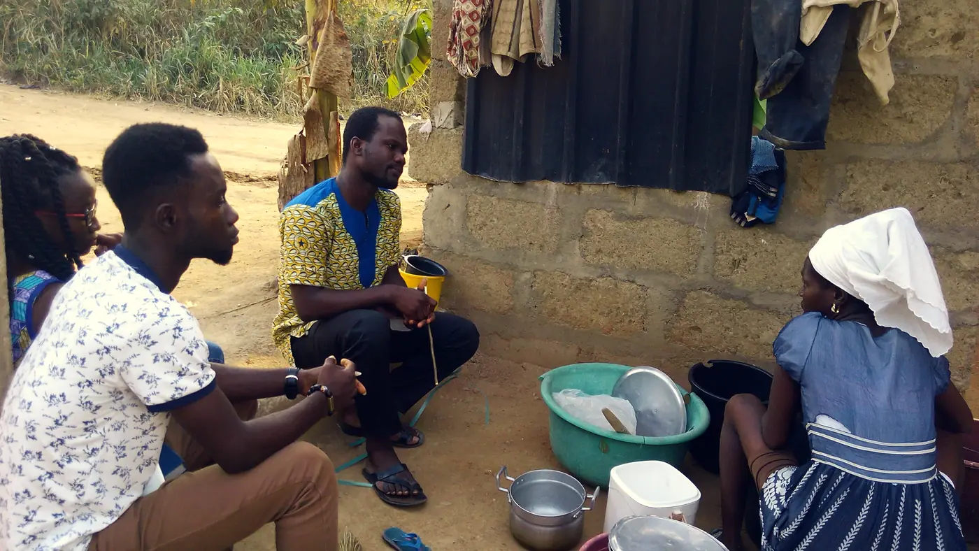 An Impact Team talking with a family during outreach